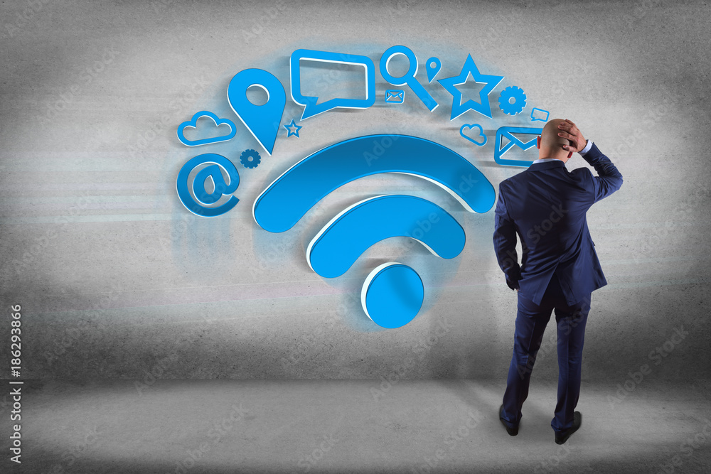 Poster businessman in front of a wall with wifi symbol connection surrounded by multimedia and internet app