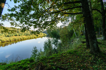 high water level in river Gauja, near Valmiera city in Latvia. summer trees surrounding