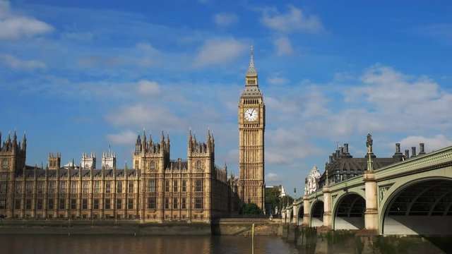 a morning view of the clock known as big ben and the river thames in london, england