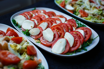 tomato with mozzarella on a buffet table