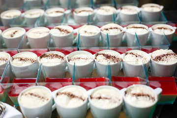 dessert in mugs on a buffet table