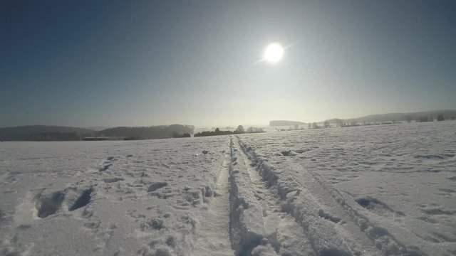 Winter, snowy landscape. Cross country skiing trail. Slow Motion.
