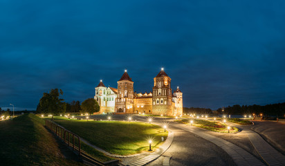 Fototapeta na wymiar Mir, Belarus. Mir Castle Complex In Evening Illumination Lighting