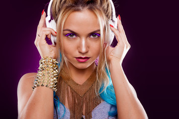 Fototapeta premium Young fashionable girl in disco style. Listening music and enjoying. Retro style
