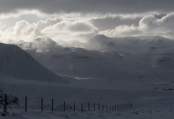 Light on snowy mountain peaks in winter remote Iceland © sue
