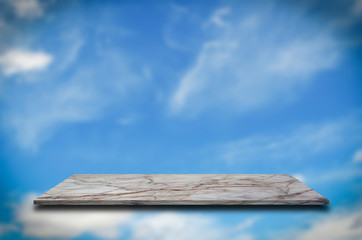 natural marble shelves and blur sky  pattern wall background use for product display.