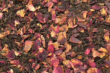 Organic Rose green tea. Macro closeup background texture. Top view.