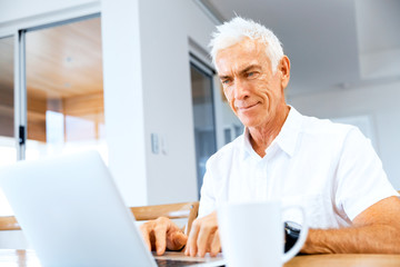 Man working on laptop at home