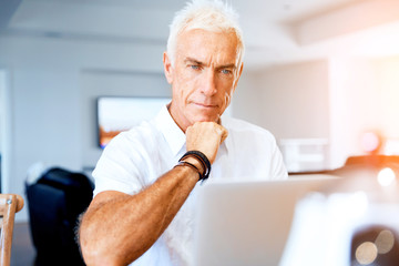 Man working on laptop at home