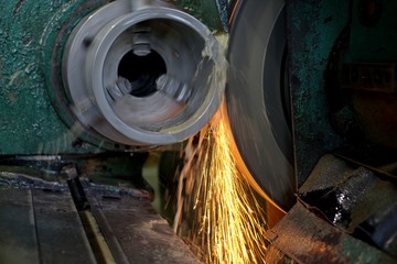 Finishing metal working on high precision grinding machine in workshop