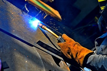 Industrial steel welder in factory