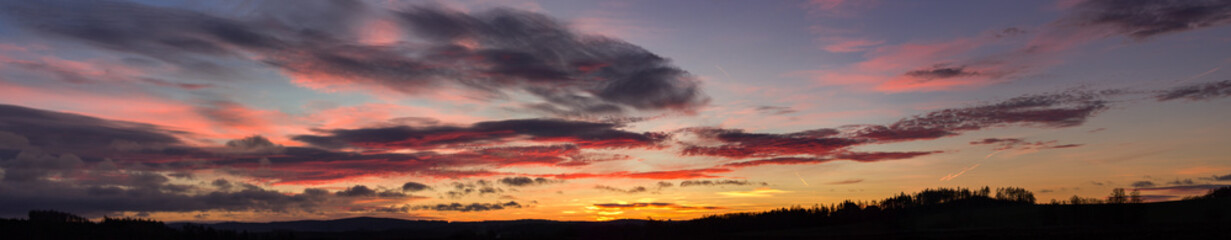 Landscape with colorful sunrise clouds panorama
