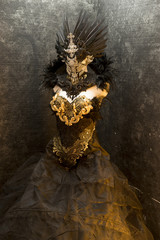 dark gothic dress formed by a silver metal tiara and a golden corset, handmade costume