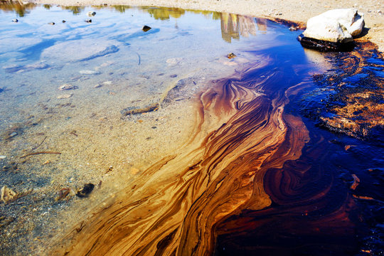Texture of crude oil spill, pools of crude oil floating on the surface of Saronic Gulf waters in Agios Kosmas bay, after the sinking of an oil tanker. Athens, Attica, Greece, September 14 2017.
