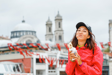 Young woman eating turkish fast food in Istanbul, Turkey