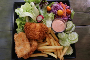 Fried fish with salad