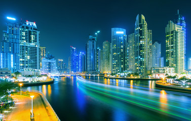 Colorful evening on canal and promenade in Dubai Marina,Dubai,United Arab Emirates