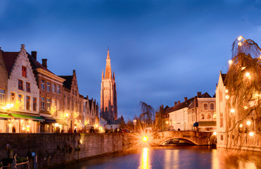 Fototapeta na wymiar Bruges cityscapes during christmas with lights and blue skies, Belgium 