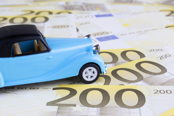 Blue Toy Car on  200 Euro Money