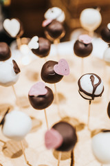 Cake pops black and white served on a buffet