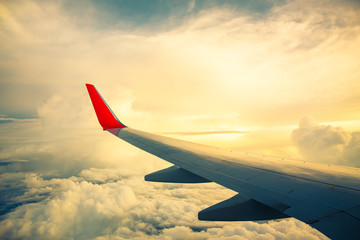 Fototapeta premium Morning sunrise with Wing of an airplane. Photo applied to tourism operators. picture for add text message or frame website. Traveling concept