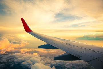 Morning sunrise with Wing of an airplane. Photo applied to tourism operators. picture for add text message or frame website. Traveling concept © pattanawit