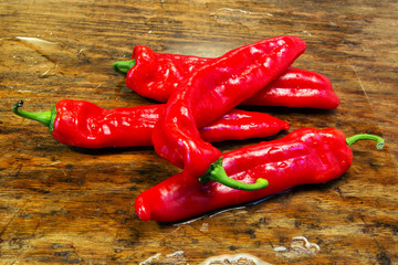 red chilies on a rustic wooden table