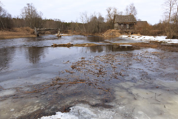 Obraz premium Old collapsed watermills near the river.