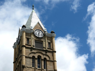 Fototapeta na wymiar The old City Hall tower on the main street of town.