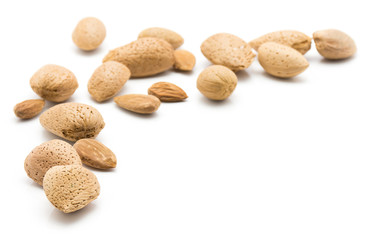 Raw almonds isolated on white background.