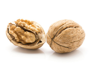Two walnuts isolated on white background one open and whole.