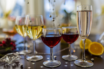 New Year's party. White and red wins and drinks in glasses.
