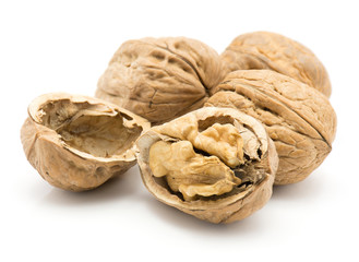 Walnuts isolated on white background one nut is open three whole and unshelled.