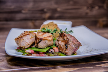 Food on a plate, on a wooden background.Food detail