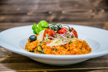 Food on a plate, on a wooden background.Food detail