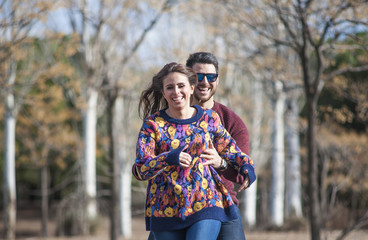 nice girl and boy running down the mountain