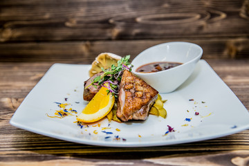 Food on a plate, on a wooden background.Food detail