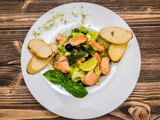 Food on a plate, on a wooden background.Food detail