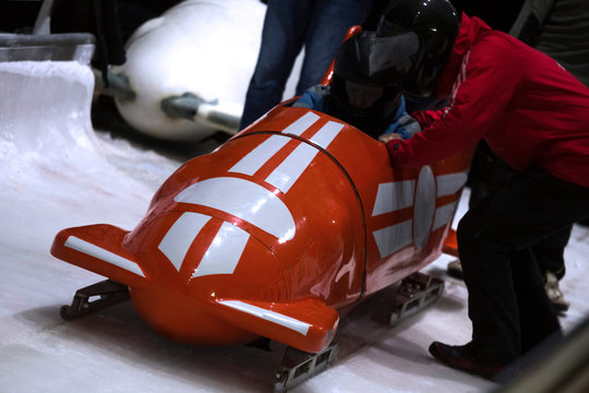 a red bob sled on the start