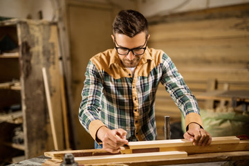 Young carpenter in a workshop