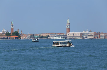 cityscape View of the island of VENICE in Italy with the ancient palaces and bell towers from the ferry boat called Vaporetto in italian language