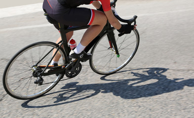 cyclist over a black bike during the curve