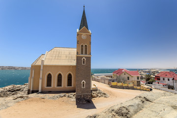 Beautiful panoramic view of the protestant german colonial church Felsenkirche in Lüderitz /...
