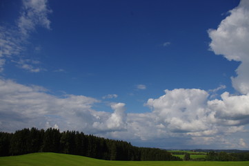 clouds green landscape