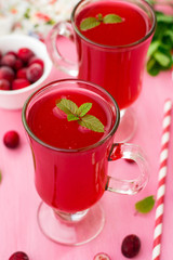 Russian traditional drink kissel with cranberries and mint