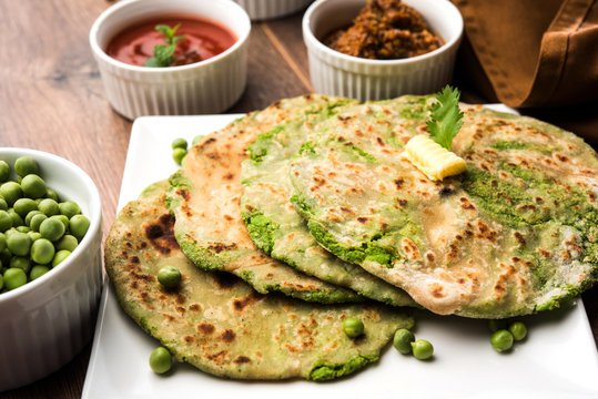 Green peas stuffed paratha or matar ka paratha, which is a traditional and popular food native to north India, made from dough of wheat flour and green peas or matar, served with mango pickle etc