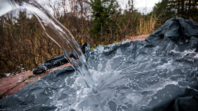 Waterproof jacket with pouring water.