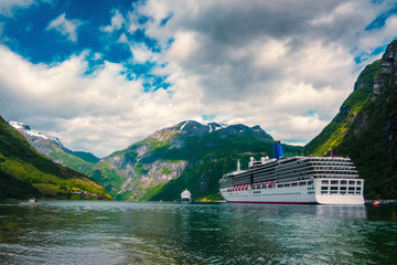 Breathtaking view of Sunnylvsfjorden fjord and cruise ship, near Geiranger village in western Norway.