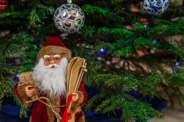 Christmas Santa Claus doll. Christmas toy under the Christmas tree Santa Clausl creates a Christmas atmosphere for children and adults