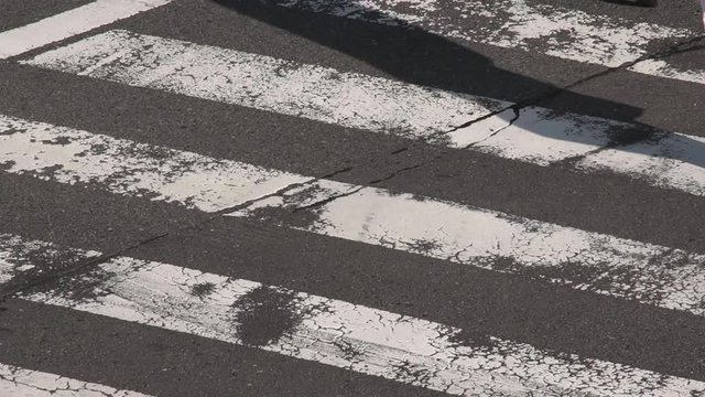 Pedestrians crossing the street in slow motion